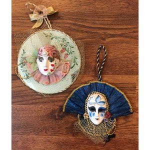 A PAIR OF MARDI GRAS STYLE PORCELAIN (believed) MASK WALL HANGINGS